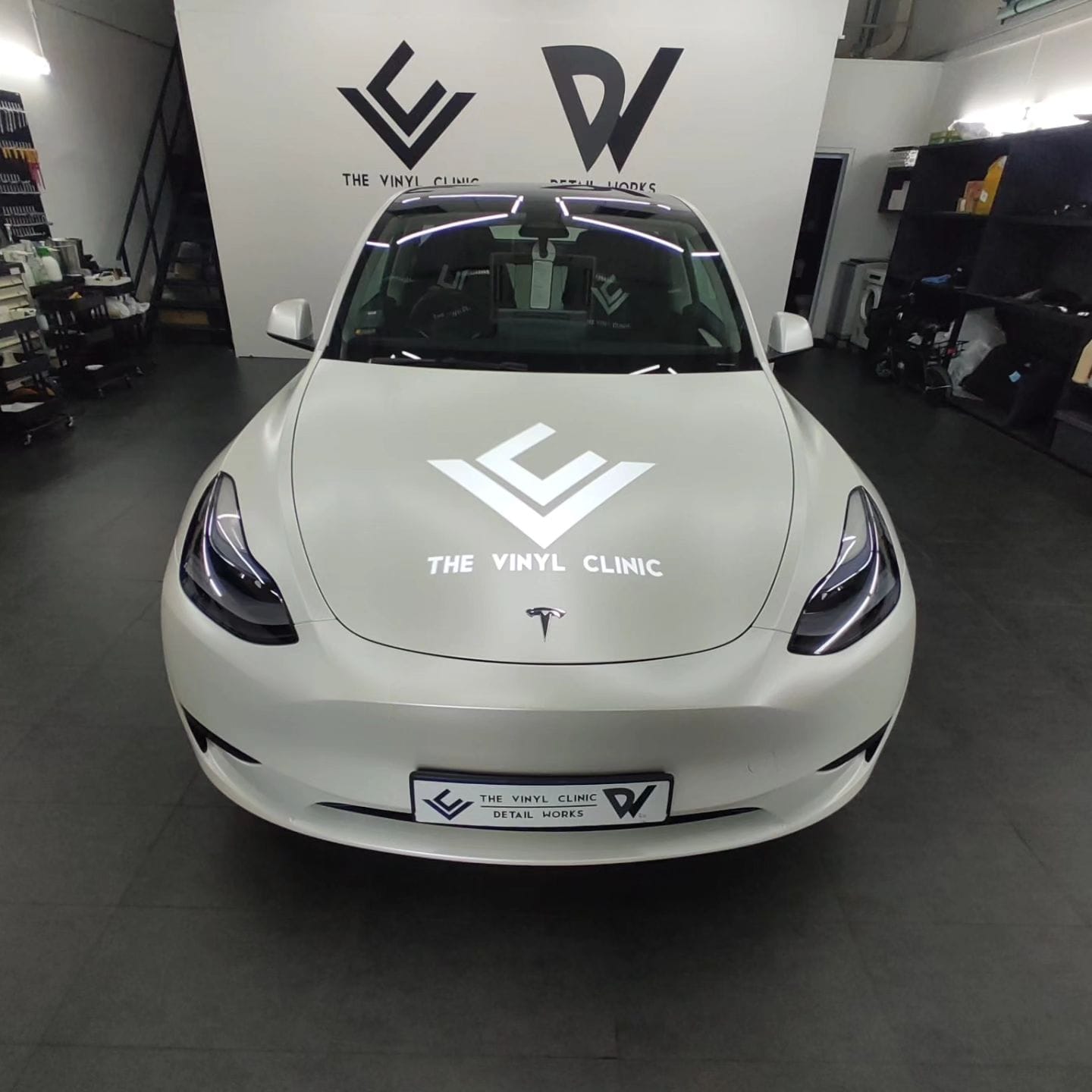 Smooth, sleek satin pearl white Model Y.