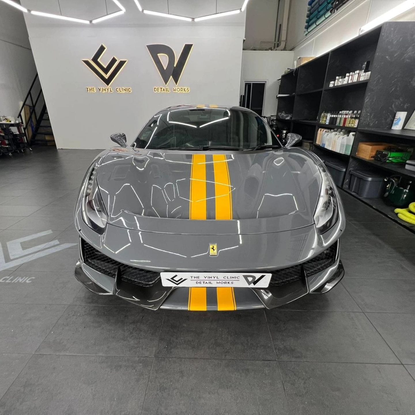 488 Pista in ultra gloss dark grey with sunflower yellow racing stripes.