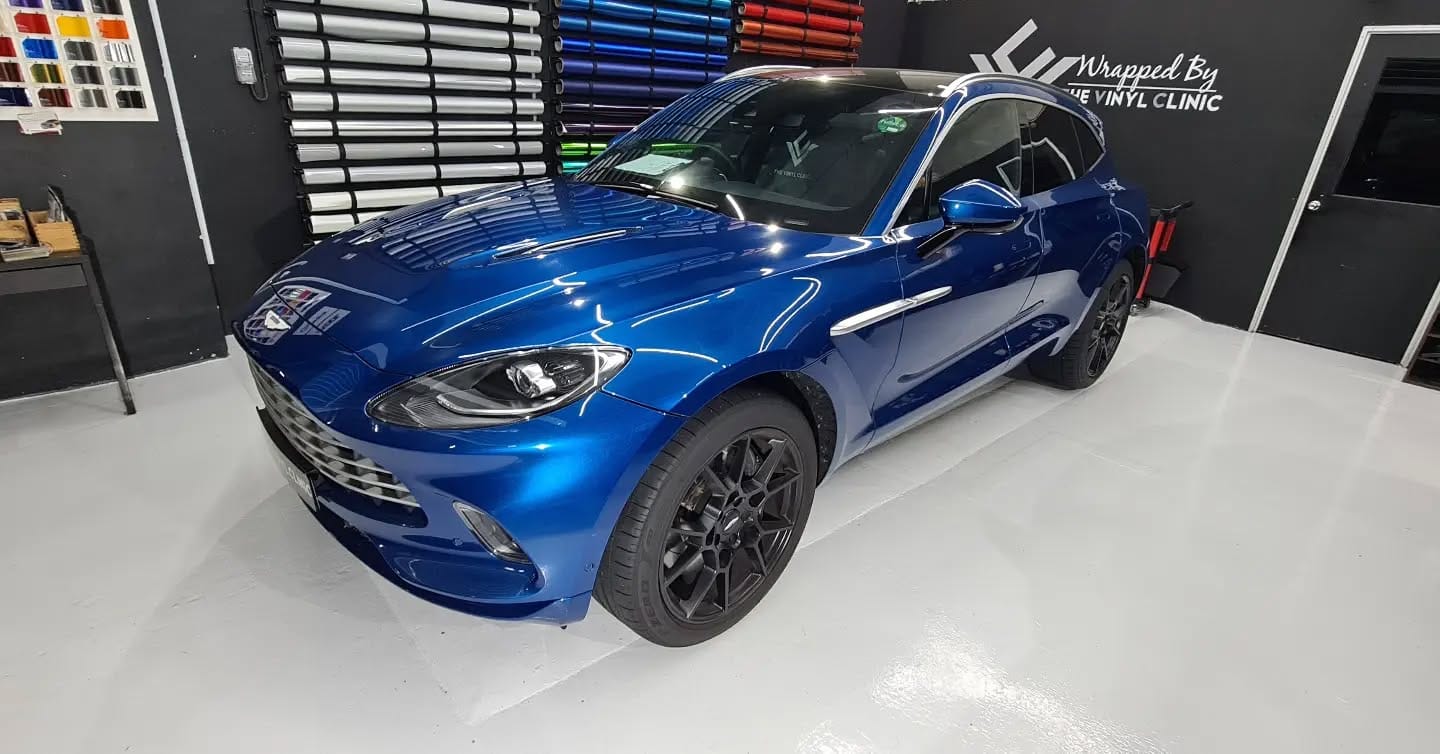 Aston Martin DBX cladded in Avery Dennison Supreme X5 glo...