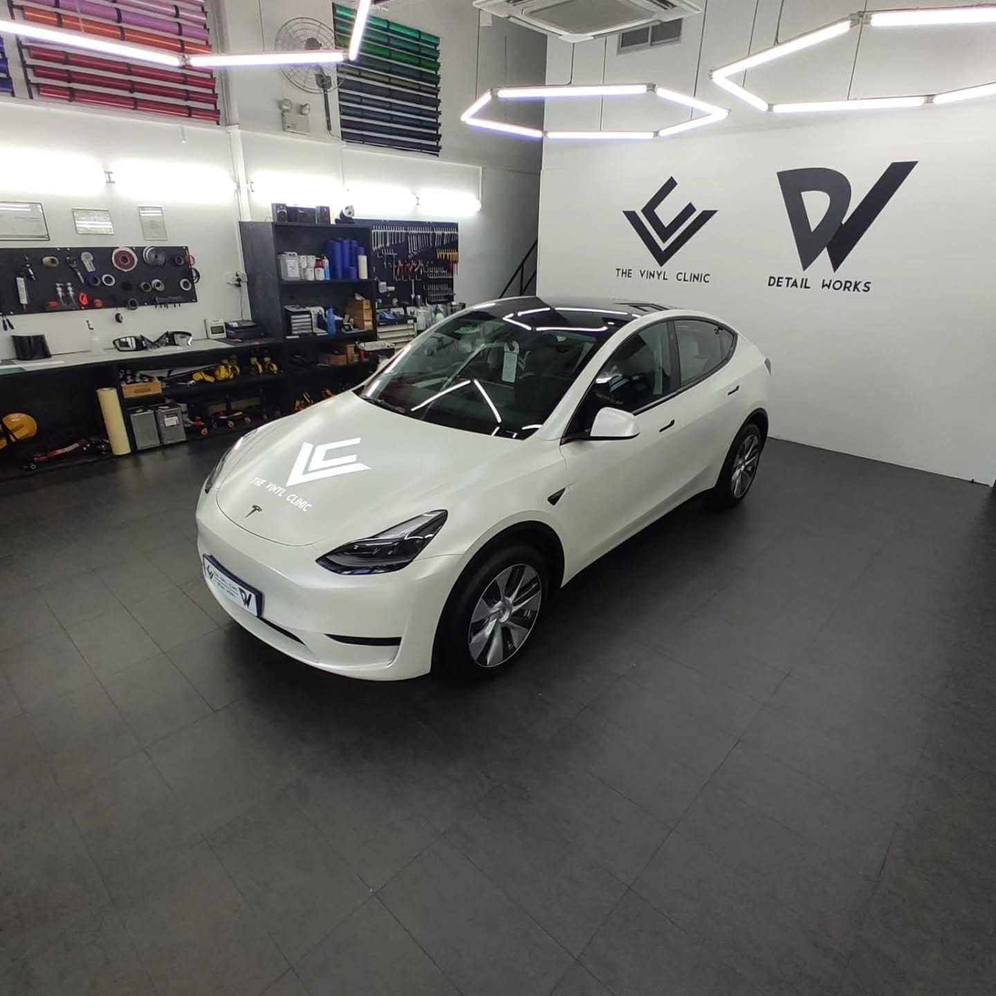 Smooth, sleek satin pearl white Model Y.