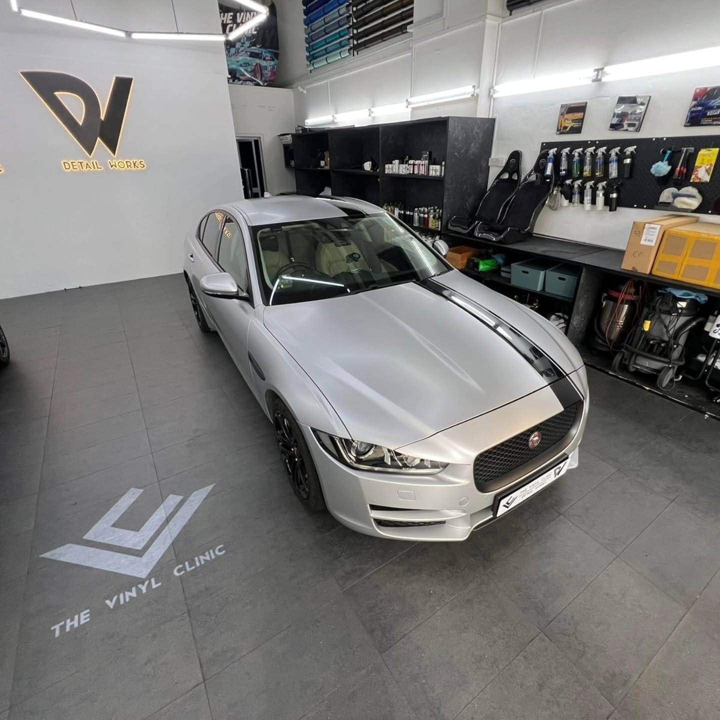 Satin silver aluminum with custom Jaguar livery.