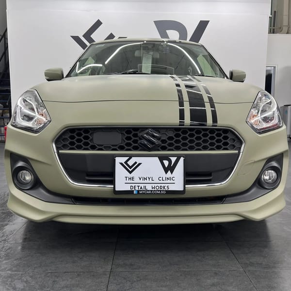 Avery Dennison matte khaki green with Mactac gloss black racing stripes.