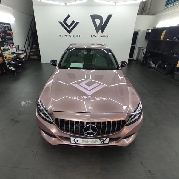 Mercedes C180 in Berry Pink.