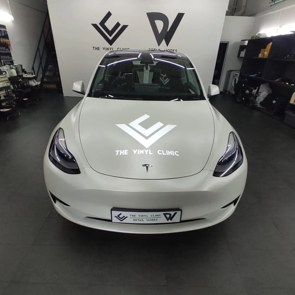 Smooth, sleek satin pearl white Model Y.