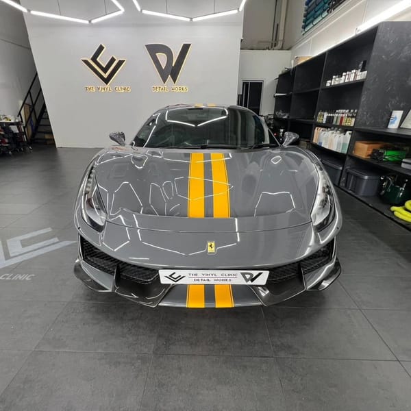 488 Pista in ultra gloss dark grey with sunflower yellow racing stripes.