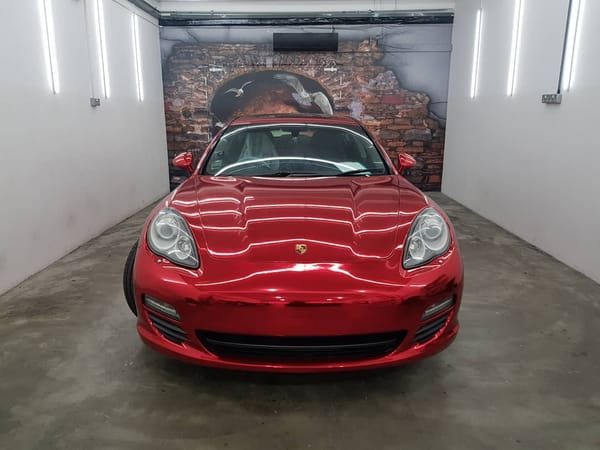 Porsche in red chrome with sprayed red calipers. Loubouti...