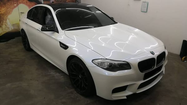 Glossy blue aura pearl white beemer. Makes us wonder what...