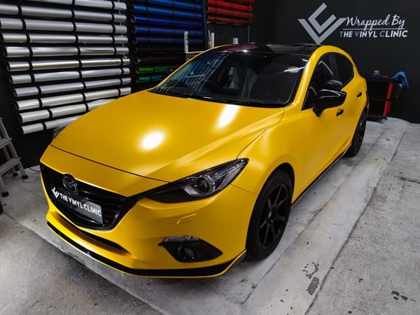 Mazda 3 in a sunny pearl metallic yellow.