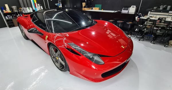 Gloss dark red with half gloss black roof.