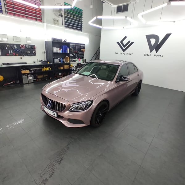 Mercedes C180 in Berry Pink.