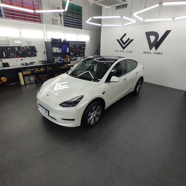 Smooth, sleek satin pearl white Model Y.